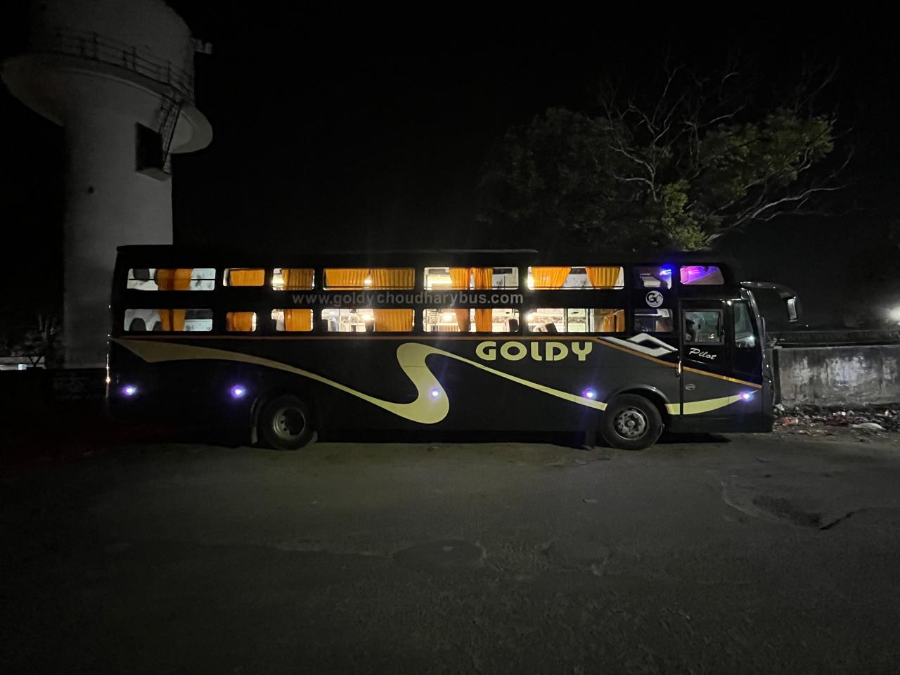 Goldy bus parked on the roadside